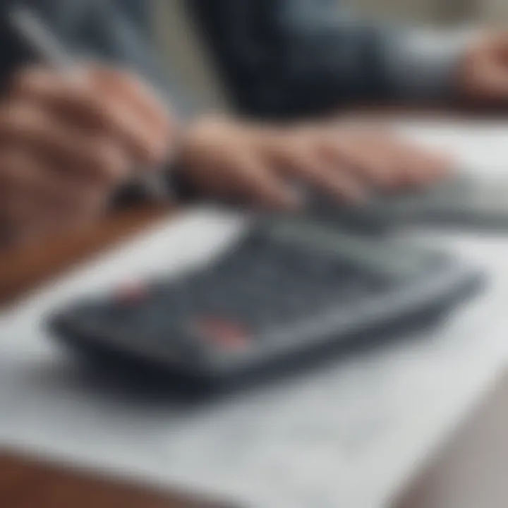 A person analyzing financial documents with a calculator.